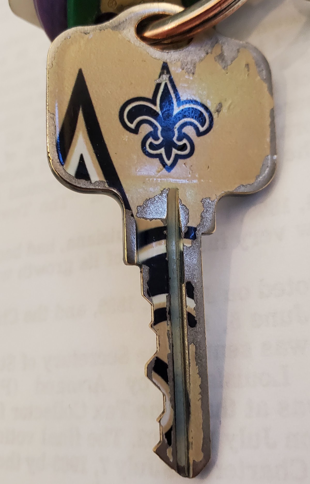 A New Orleans Saints fleur-de-lis key cut at A & A Locksmith